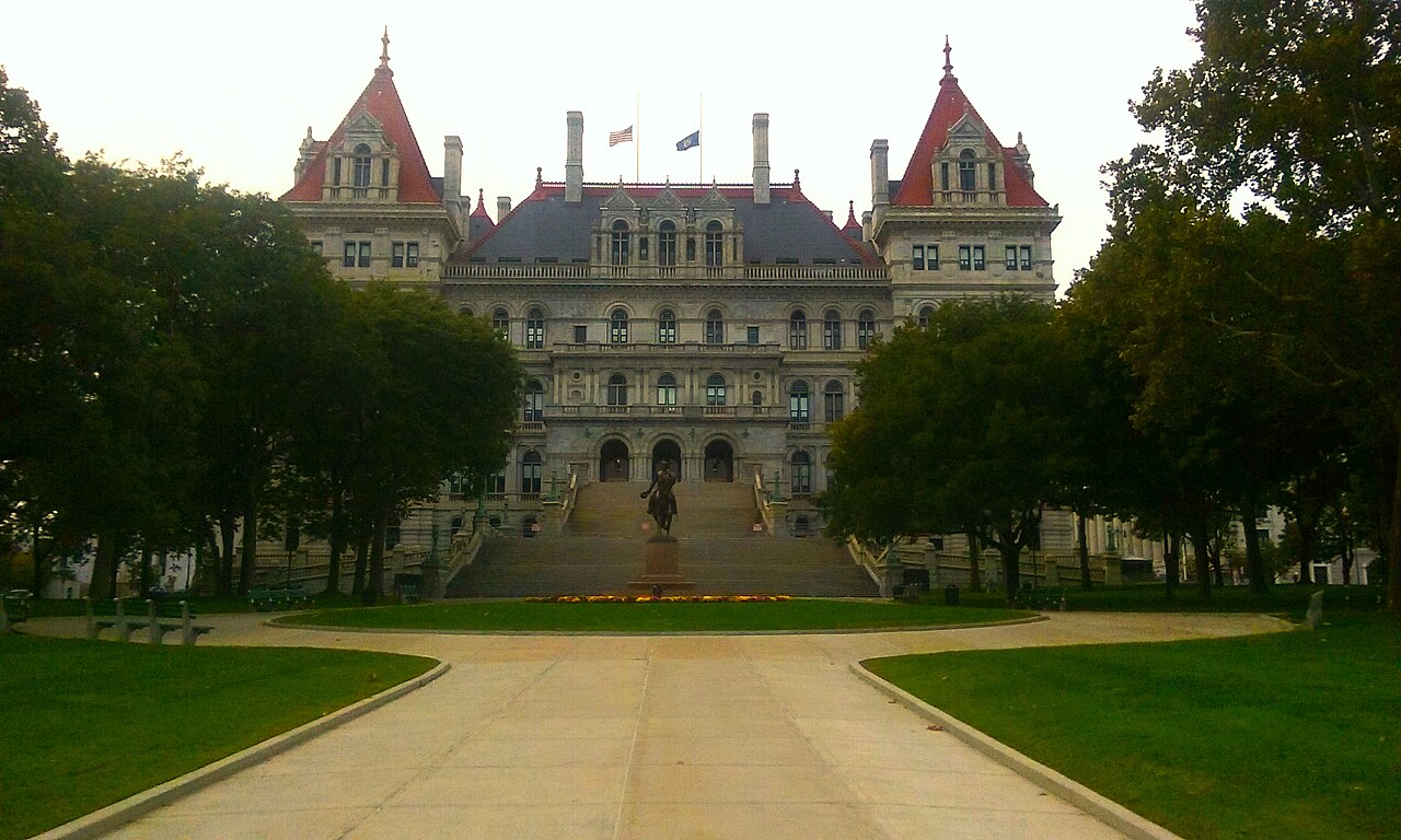 New York State Capitol above a tree-lined plaza in Albany, New York