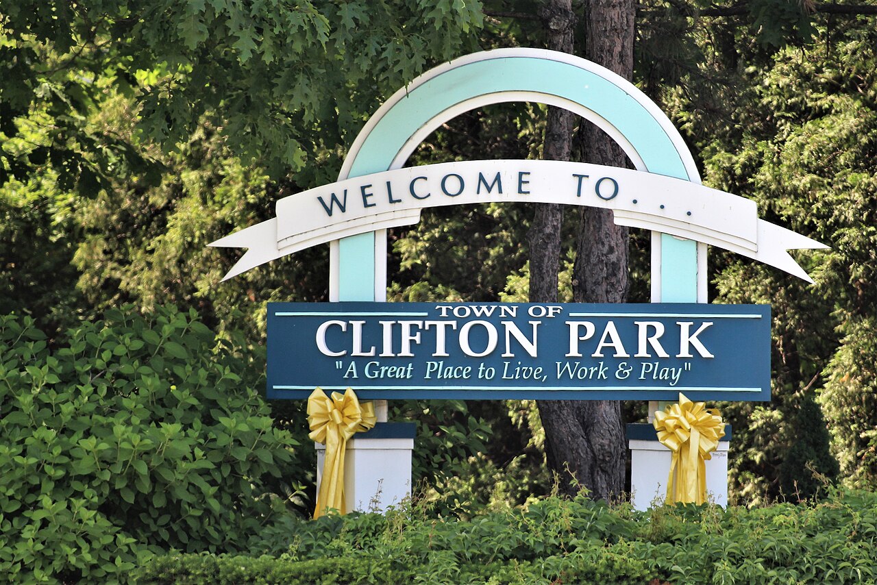 Town of Clifton Park welcome sign surrounded by leafy trees